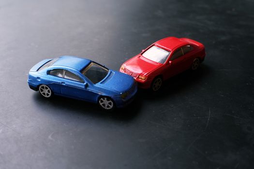 Toy cars crash accident. Simulation  red and  blue car.