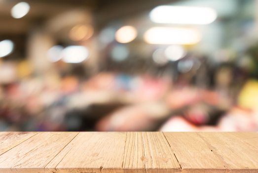 Empty wooden table in front of abstract blurred background of bokeh light . can be used for display or montage your products.Mock up for display of product