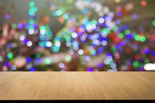 Empty wooden table in front of abstract bokeh background . can be used for display or montage your products.Mock up for display of product. for Christmas, new year celebration 