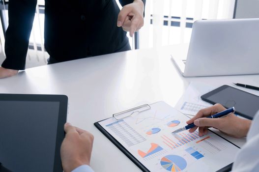 Business people making presentation with his colleagues and business tablet digital computer as meeting concept