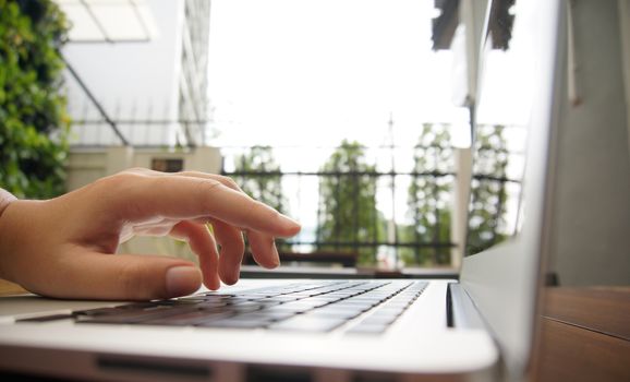 The Casual business woman works Hand typing on laptop keyboard