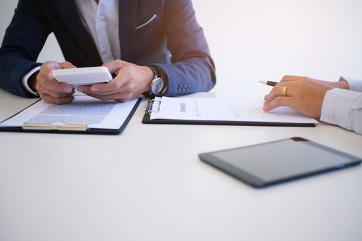 Sales manager giving advice application form document, considering mortgage loan offer for car and house insurance