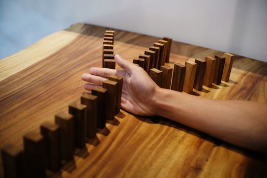 Planning risk and strategy in businessman gambling placing wooden block.Business concept for growth success process.