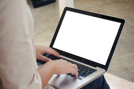 The Casual business woman works online on laptop which hand on keyboard in her house Isolated screen in laptop