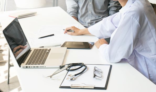 medicine doctor explain diagnosis to doctor team holding and showing clipboard exploring important document