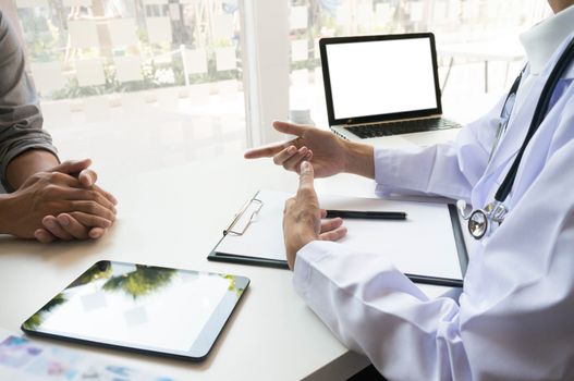 medicine doctor explain diagnosis to doctor team holding and showing clipboard exploring important document