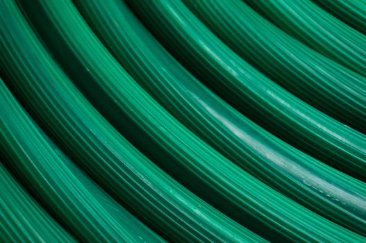 Abstract of Green Rubber tube Texture for watering plants in the garden.