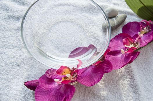 Water bowl and Spa manicure accessories, Orchid on white background.