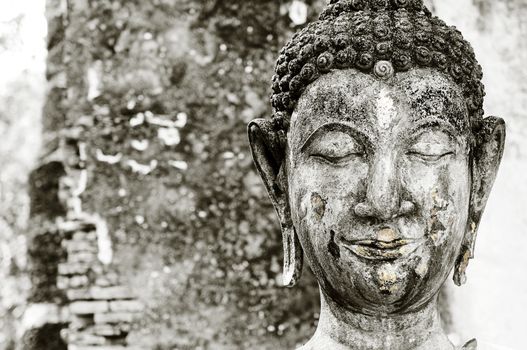 Closeup of old Buddha sculpture.