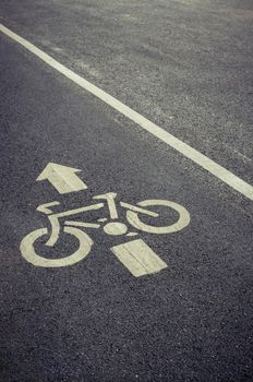 bicycle lane sign on the road