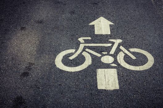 bicycle lane sign on the road