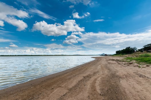 blue sky with clouds sky with marsh beach landscape