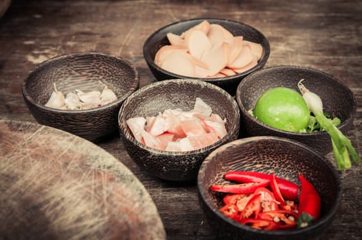 ingredient of raw food in small wood cup closeup