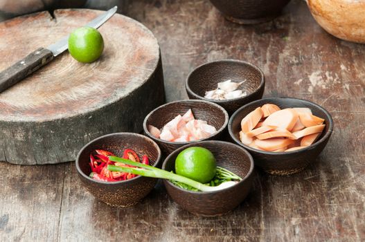 ingredient of raw food in small wood cup closeup