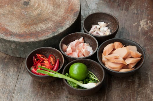 ingredient of raw food in small wood cup closeup