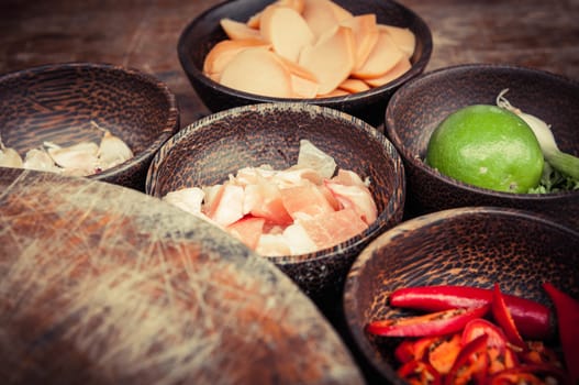 ingredient of raw food in small wood cup closeup