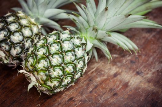 Closeup of pineapple on wooden background