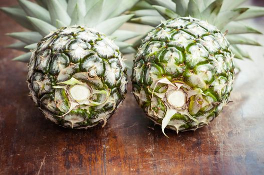 Closeup of pineapple on wooden background