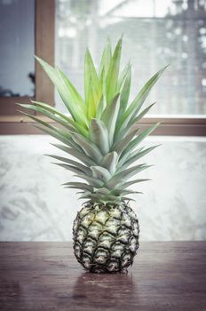 pineapple on wood table closeup