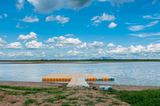 pontoon float in the marsh and clouds sky
