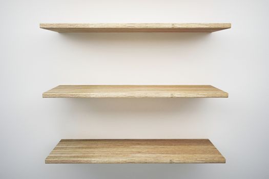 wood shelf on white wall