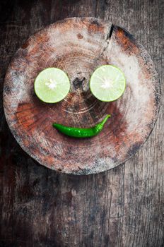 Green Lemon cut on wood block