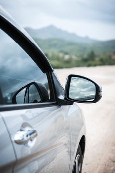 Closeup side of car door mirror glass