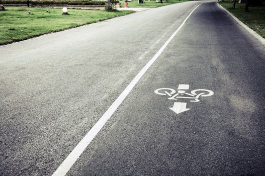 bicycle lane sign on the road