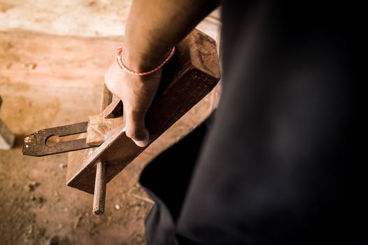 planer tool in a carpenter hand
