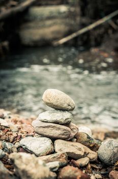 zen basalt stones and waterfall in forest