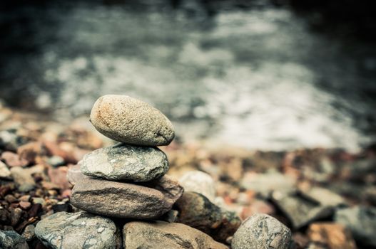zen basalt stones and waterfall in forest