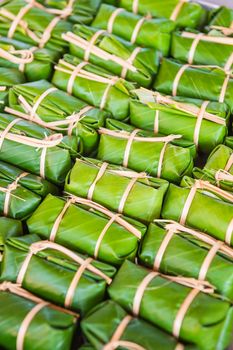 Green background of Khao Tom Mad, dessert food of Thailand culture