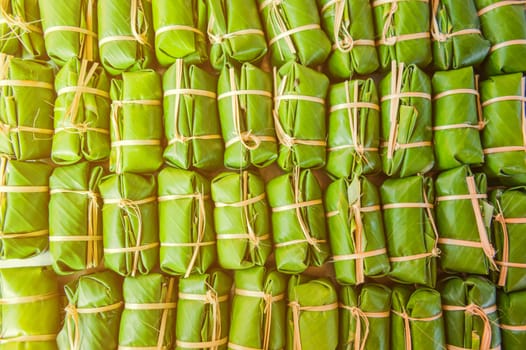 Green background of Khao Tom Mad, dessert food of Thailand culture