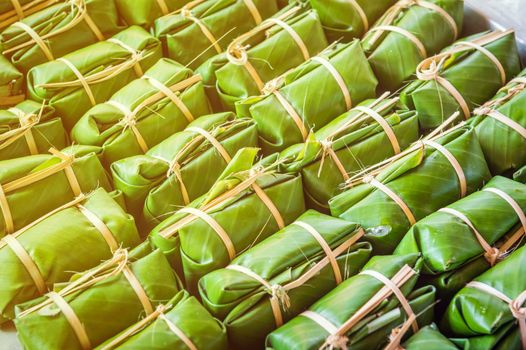 Green background of Khao Tom Mad, dessert food of Thailand culture