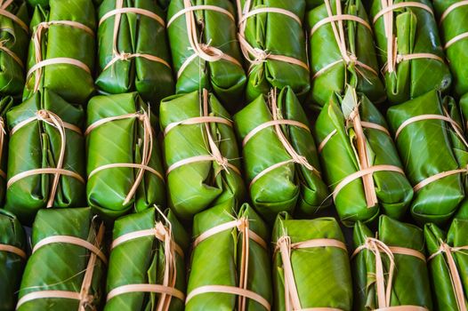 Green background of Khao Tom Mad, dessert food of Thailand culture