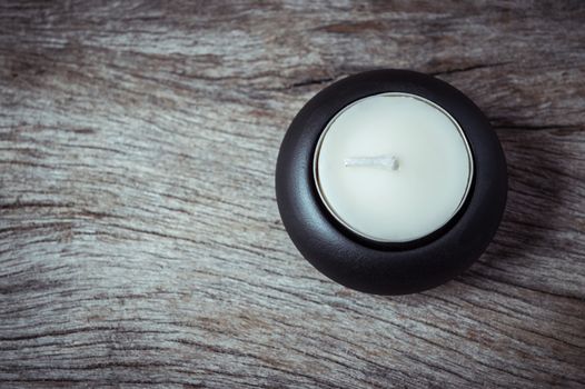 candle light on grunge wood background