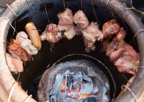 roasted pork in a big earthen jar, food stylish of Thailand native traditional