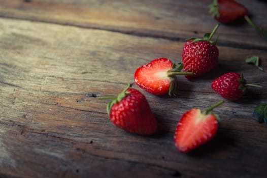 closeup of strawberry fruit on grunge wooden