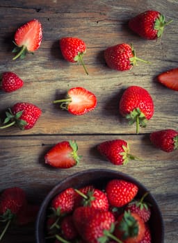 strawberry fruit on grunge wooden background