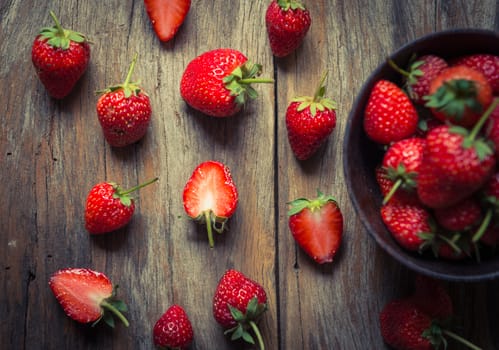 strawberry fruit on grunge wooden background