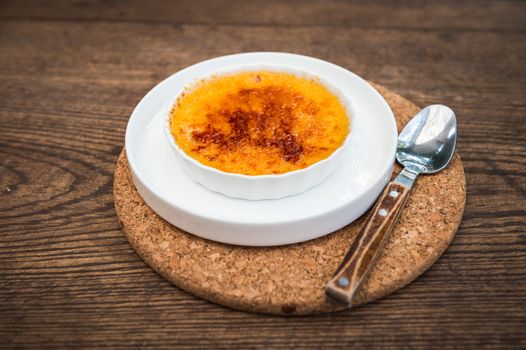 creme brulee sweet food on wooden background
