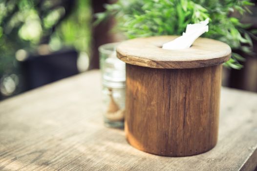 closeup of tissue paper in wood circle box