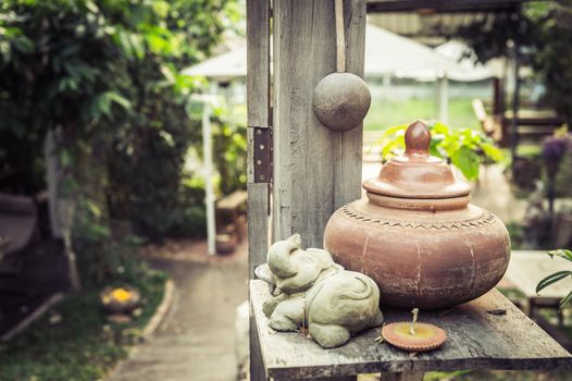 baked clay on wood table, traditional of Thailand