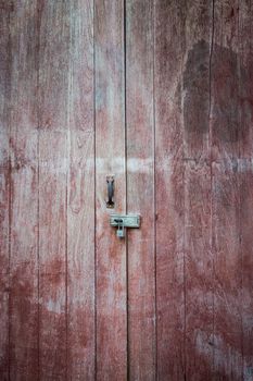 Closeup of old key lock with wood door