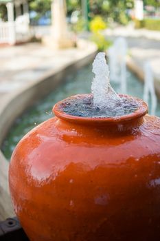 Closeup of water jar fountain