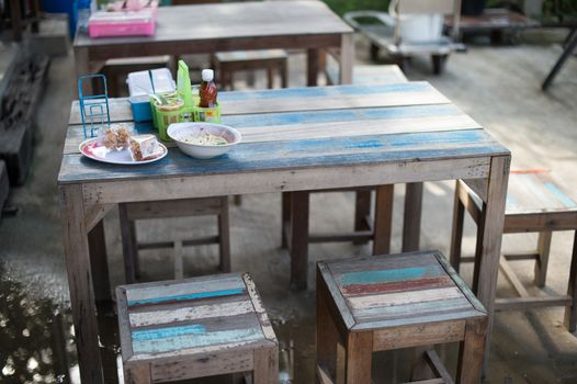 closeup of vintage table and stool set in food shop