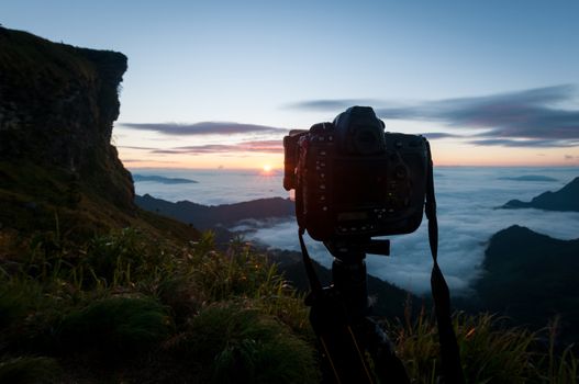 Camera take a photo of sunrise view landscape, Traveler conception.