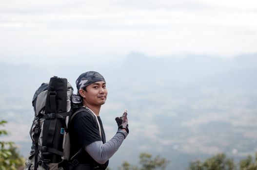 Man traveler portrait with landscape on mountain