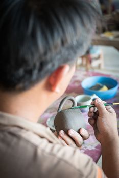 Closeup of sculptor man hand with him job