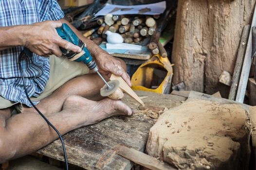 closeup of sculptor man with him job